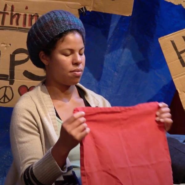 Image of woman folding laundry